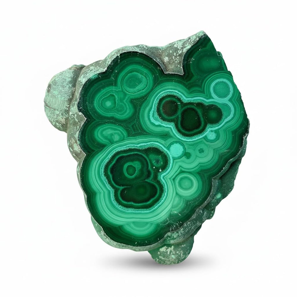 Malachite slab with raw edge enhances desk decor and natural texture.