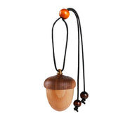 Maromalife wooden acorn car diffuser hanging on rearview mirror for a fresh scent