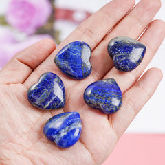 Polished lapis lazuli heart stone by Marrywindix showing the glossy finish