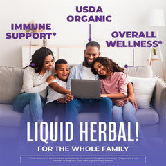 Dropper dispensing MaryRuth Organics elderberry syrup for convenient dosing.