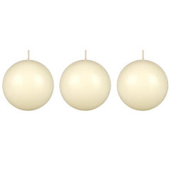 Mega Candles ivory ball candle on table creates warm ambience for dining.