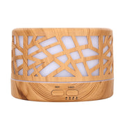 Messentials Wild Essentials diffuser front view with wood branch design for calm spaces