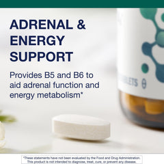 Metagenics E-400 selenium bottle on desk for daily supplementation.