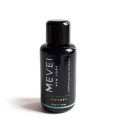 MEVEI Victory bottle pour illustrating easy application during sports massage sessions.