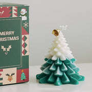 Mewealth Christmas Tree Candle glowing to create cozy winter ambiance