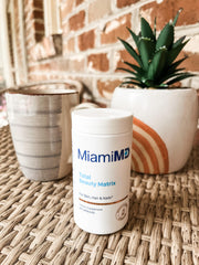 MiamiMD Total Beauty Matrix capsules closeup, smooth texture visible.