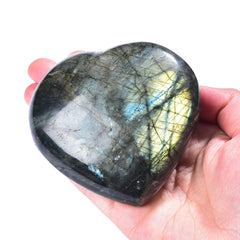 MOGEMT Labradorite heart crystal in hand shows size and natural texture for rituals.