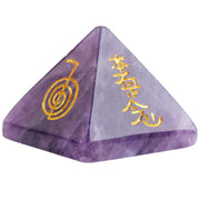 Mookaitedecor amethyst pyramid with engraved chakra symbols for focused meditation and balance.