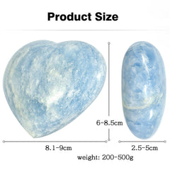Blue celestite heart by Mookaitedecor resting on desk with soft light