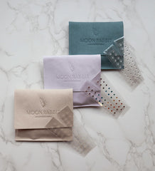 Moon Rabbit rose gold tweezers for precise ear seed application.