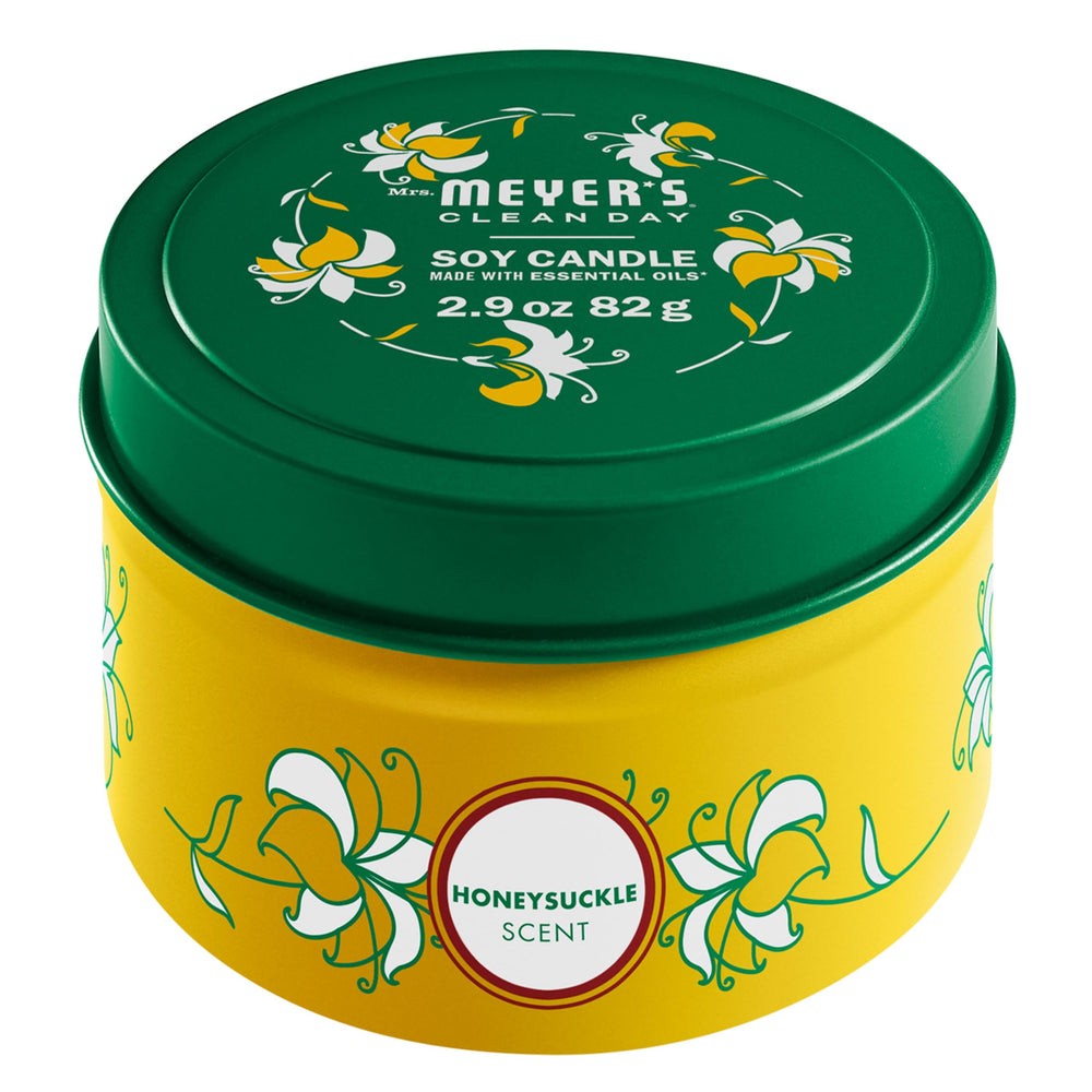 Mrs. Meyer's Clean Day Honeysuckle tin candle with honeysuckle scent for a fresh, garden-inspired room.