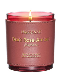 M&SENSE Rose Amber candle in a glass jar emits warm glow for cozy evenings.