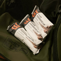 MTN OPS Protein Bar on a gym bag, ideal post-workout recovery snack