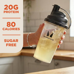 Myprotein Clear Whey Isolate Tropical Dragon Fruit tub with scoop ready to mix