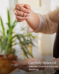 Pendulum over a chakra diagram illustrating balance and energy checks