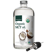 Natural Force Organic MCT Oil bottle on a counter, ideal for keto meals and smoothies.