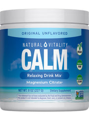 Natural Vitality Original Calm bottle beside a glass for a relaxing routine.