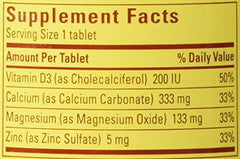 Nature Made Calcium Magnesium and Zinc Tabs closeup label shows vitamin D aiding calcium absorption