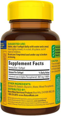 Nature Made Vitamin E softgels poured into hand for easy daily dose