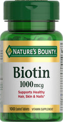 Nature's Bounty Biotin 1000 mcg tablets, close-up view, supports cellular energy.