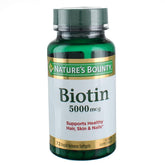 Nature's Bounty Biotin 5000 mcg bottle close-up, three-pack for daily support.