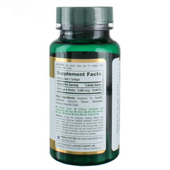 Nature's Bounty Biotin softgels poured from bottle for easy daily use.