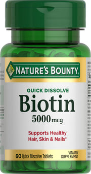 Nature's Bounty Biotin quick-dissolve tablet close-up, highlighting energy metabolism and hair support.