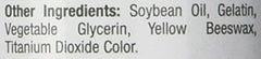 Nature's Bounty Biotin softgel capsules in hand for daily routine.