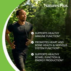 NaturesPlus Magnesium tablets in hand, convenient daily supplement on the go.