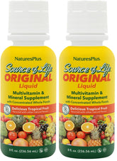 NaturesPlus Source of Life Liquid tropical fruit bottle on countertop, rich in essential nutrients for daily energy support