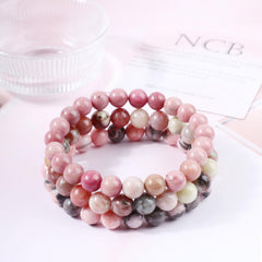 NCB Pink Black Rhodonite bracelet close-up with deep hues for versatile wear.