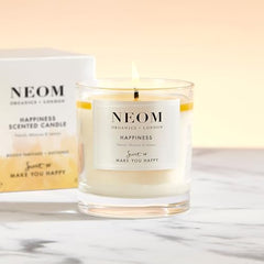 NEOM Happiness candle label close-up emphasizing natural wax for clean burn.