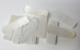 New Age Imports selenite sticks 2-3in for meditation and energy cleansing.