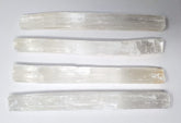 New Age Imports selenite sticks 7-8 inch for cleansing energy and home protection.