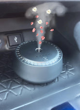 New Smart Aroma Diffuser in car angle, enhancing cabin scent on the go.