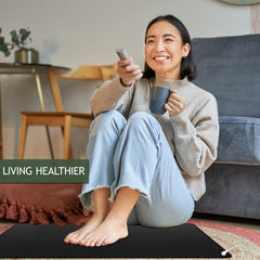 NIULAFR grounding mat during yoga demonstrates versatile use for relaxation and focus.
