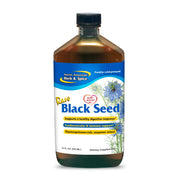North American Herb & Spice black seed oil bottle on a wooden counter for daily rituals