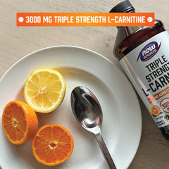 Measuring spoon shows precise NOW L-Carnitine Liquid dosing for easy timing.