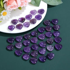 NUKAYAI amethyst heart in hand: handheld relaxer for focus and centered breathing.