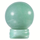 Nupuyai green aventurine sphere on its stand calms room energy.
