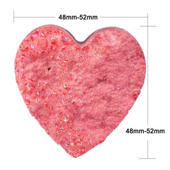 Nupuyai heart-shaped pocket stone showing its compact size and portability.