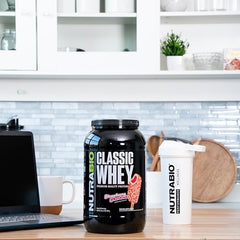 NutraBio Classic Whey scoop-dispensing image shows easy daily protein portion.