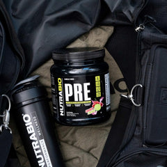 NutraBio PRE Workout old formula glass shows cherry limeade hydration during sessions.