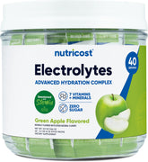 Nutricost Electrolytes Green Apple stickpack on counter for on-the-go hydration.