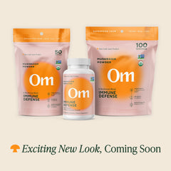 OM Mushroom Superfood bottle closeup highlighting organic vegan ingredients.