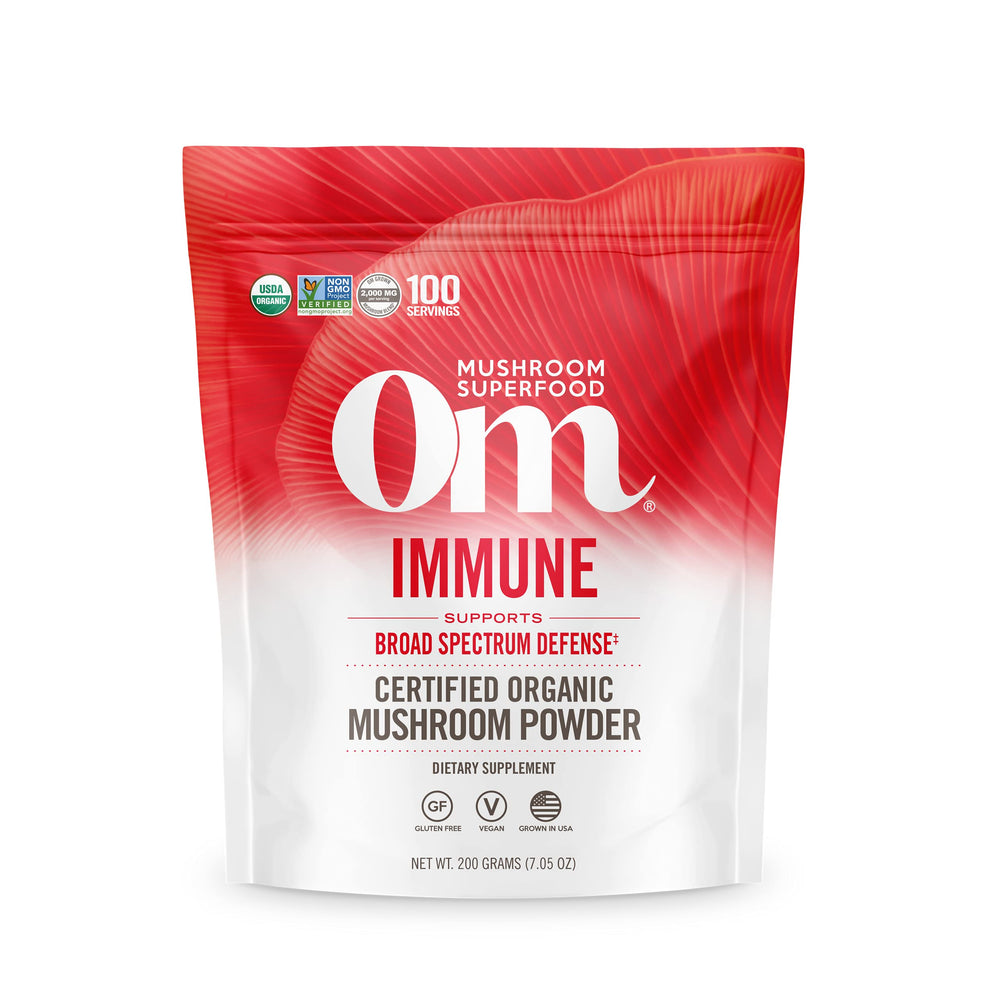 OM Mushroom Superfood powder in a pouch for daily immune wellness.