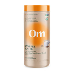 OM MUSHROOM SUPERFOOD coffee latte blend canister showing the rich powder for daily energy and focus