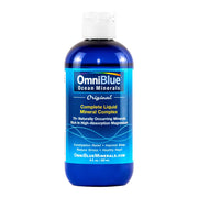 Pouring OmniBlue Ocean Minerals into water to support hydration and electrolyte balance.
