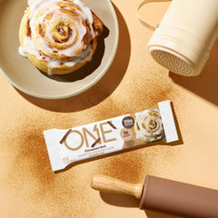 ONE Cinnamon Roll Bar nutrition facts show 20g protein and 1g sugar.