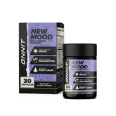 ONNIT New Mood bottle and capsules on desk for daily stress support